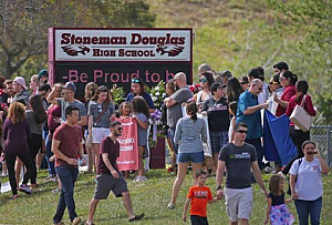 Parents and students returning to Marjory Stoneman Douglas High School in Parkland, Florida on Fe...