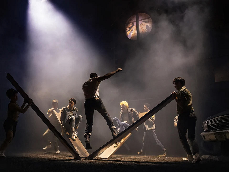 Actors on stage with a diffused spotlight