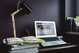 Laptop and stack of books