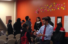 Students connecting with representatives from the organizations after the presentations.