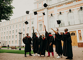 Photo of graduates throwing their graduation cap.  Photo by RUT MIIT on Unsplash