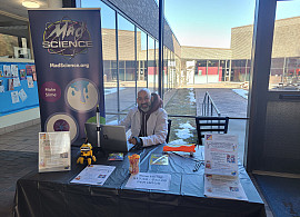 Mad Science recruiter hosting a table on campus.