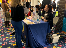 Student speaking with an employer at the 2024 Job & Internship Fair