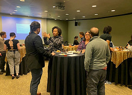 Students, alumni, and staff practicing networking.