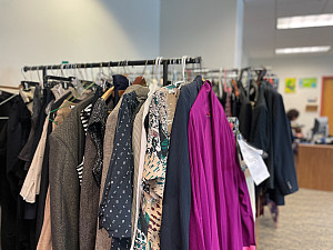 Racks of gently used and new clothing available in the CDC Professional Closet.
