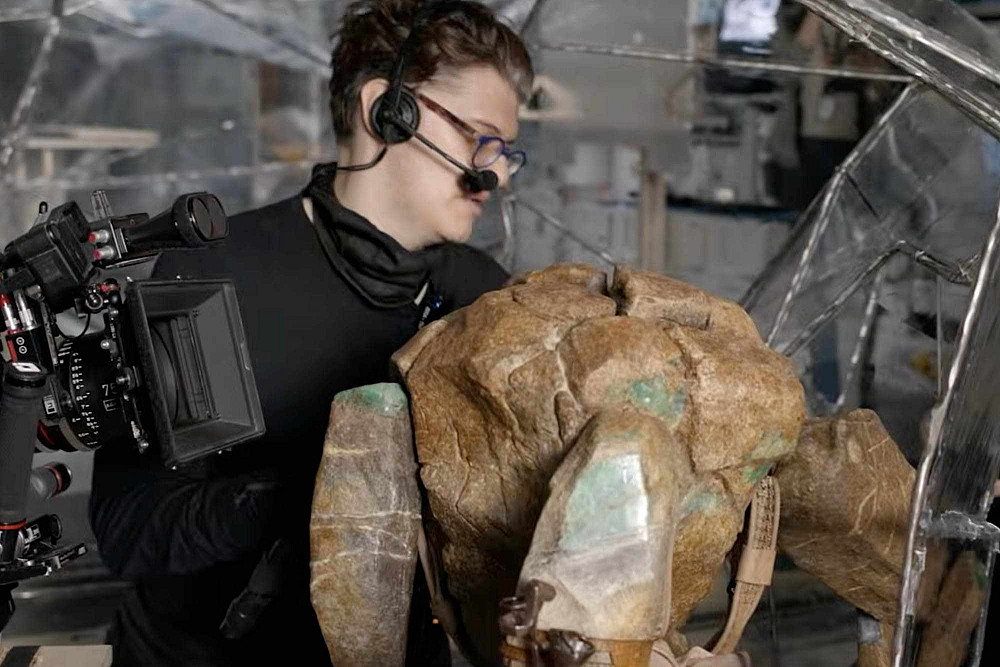 James Ortiz '10 with Rocky, the puppet in Project Hail Mary. (Amazon/MGM)