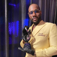 Nicco Annan '98 at the NAACP Convention July 2022 holding the inaugural Trailblazer Award.