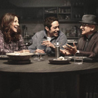 Edie Falco, Pete Davidson, and Joe Pesci sit at a table in scene from BUPKIS TV comedy