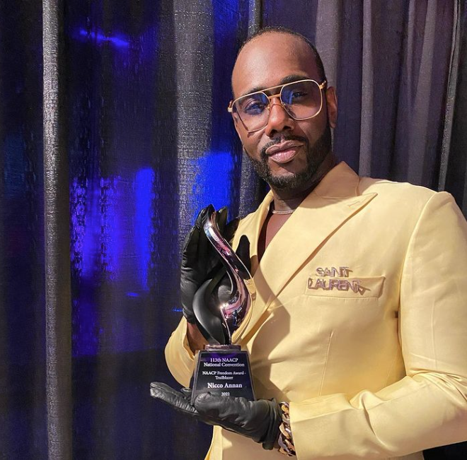 Nicco Annan '98 at the NAACP Convention July 2022 holding the inaugural Trailblazer Award.