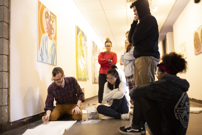 Faculty and students in VA building