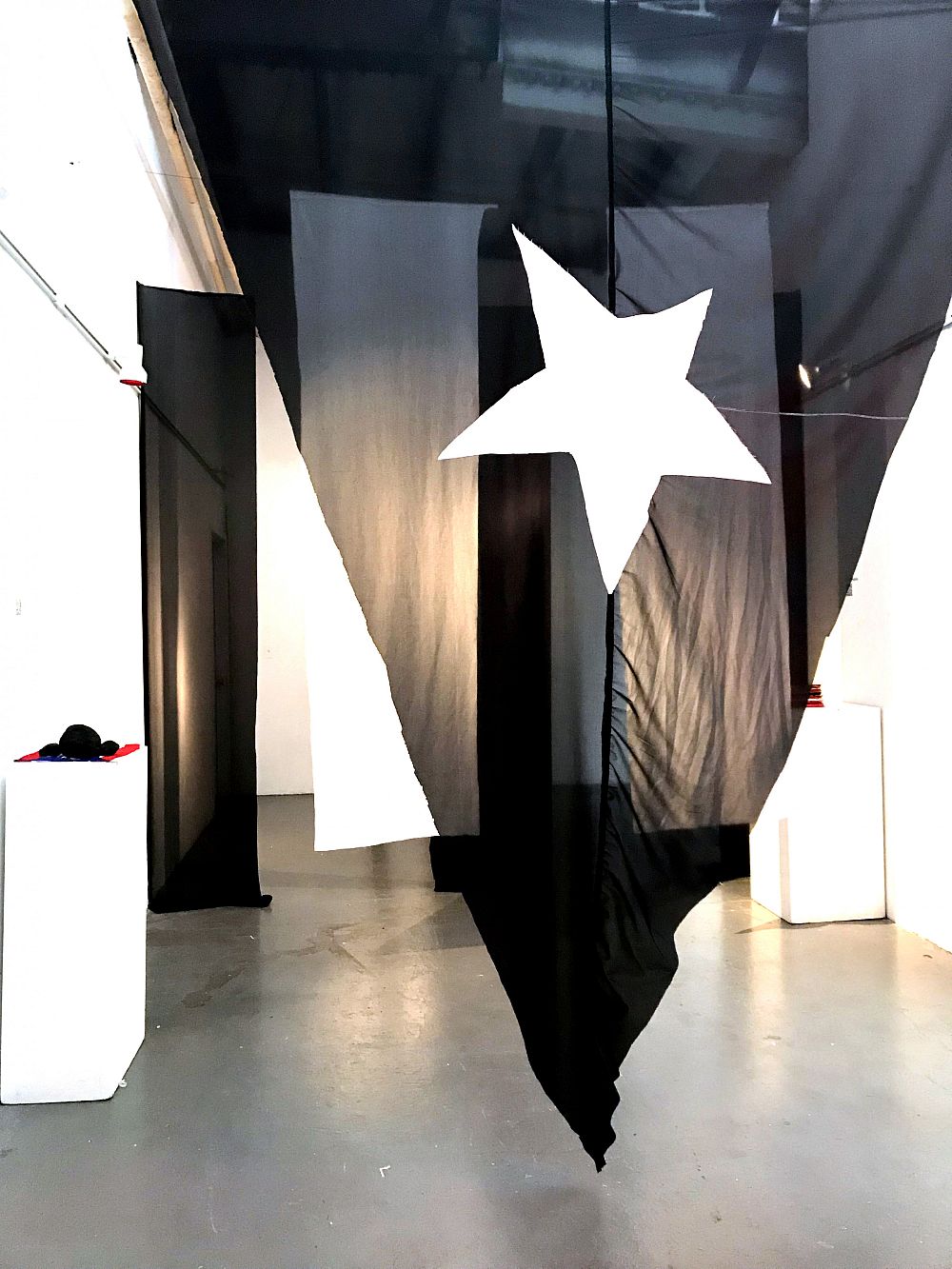Que Bonita Bandera, hung fabric installation, band: 8'H 2'W, triangle: 9'W 8'H, 2019