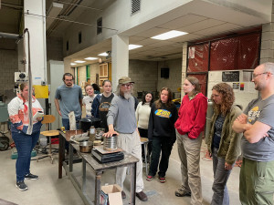 Ken Weeks demonstrates birchbark canoe techniques to students in Bradley Pitts' Land Foundations class.