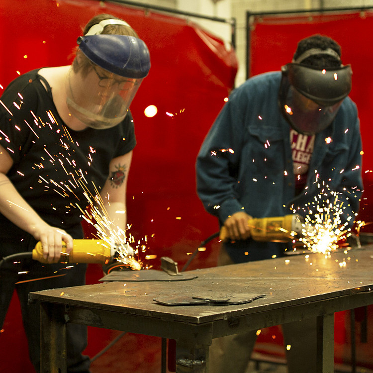 Sculpture students working in the shop