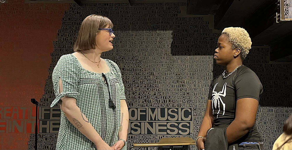 Lily Thrall '14 speaks with a student.