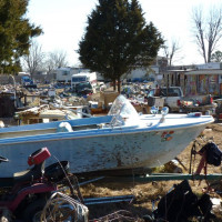 Abandoned vehicles and refuse fill a lot near a meth lab in Missouri.