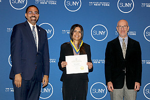 SUNY Chancellor John King, Sonia Seth '23 holding a certificate, and Director of the School of Natural and Social Sciences Rudolf Gaudio.