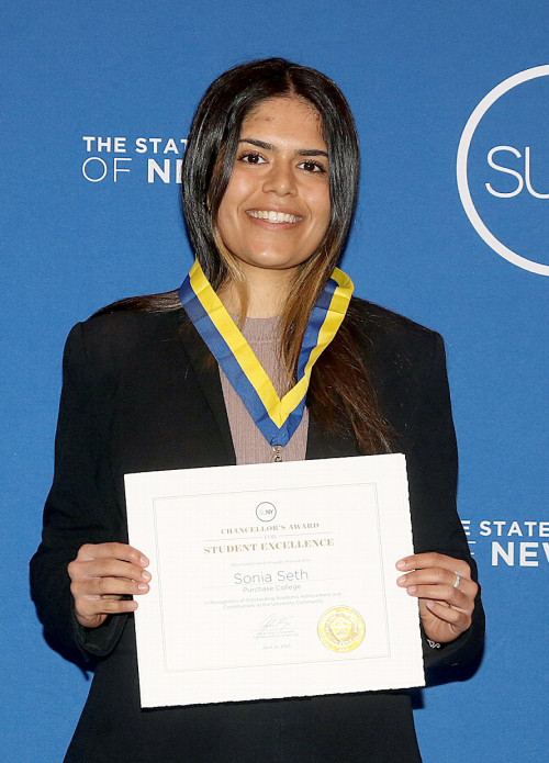 SUNY Chancellor John King, Sonia Seth '23 holding a certificate, and Director of the School of Natural and Social Sciences Rudolf Gaudio.