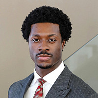 Portrait of a young man in a suit.