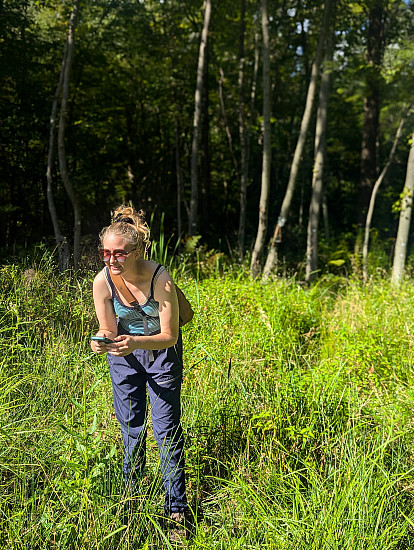 Student taking iNaturalist observations in the field