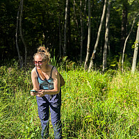 Student taking iNaturalist observations in the field