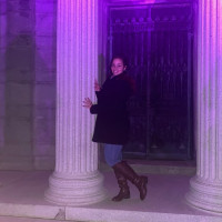 Skylar standing on steps at Woodlawn Cemetery