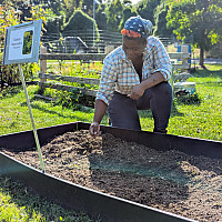 Jolie, Land Stewardship intern at work in the Purchase Native Species Garden.