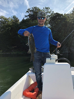 Zach Zarrella conducting fishing surveys