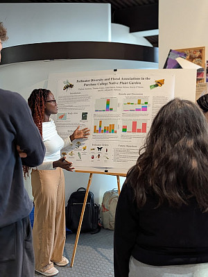 Student presenting their poster