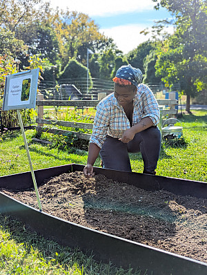 Jolie, Land Stewardship intern at work in the Purchase Native Species Garden.