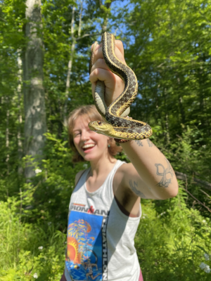 Robyn holding a snake in the Purchase Preserve