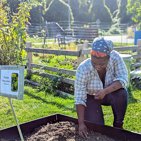 Student Jolie working in the native plant garden