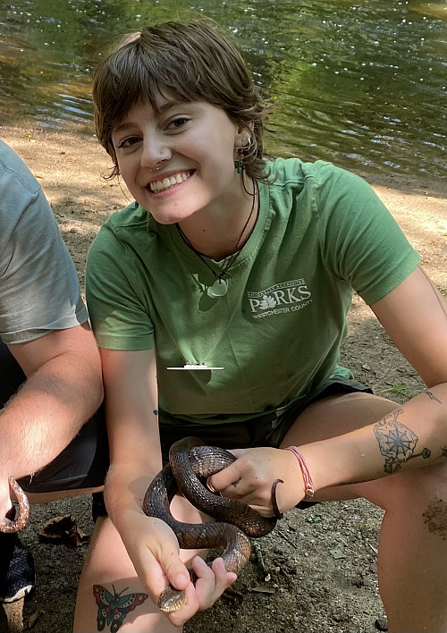 Robyn Graygor '25 holds a snake