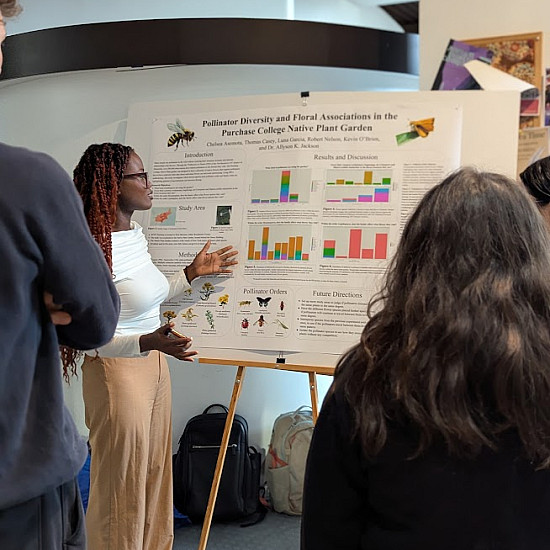 Student presenting their poster