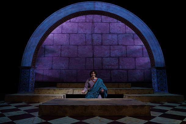 Plato sits center