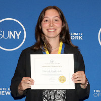 SUNY Chancellor John King, Hannah Kaebnick (holding a certificate), and Rudolf Gaudio, Director of Natural and Social Sciences