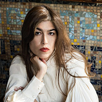 Portrait of Monica Ferrell, chin resting on her hand