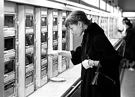 Audrey Hepburn Viewing the available food option in the Automat