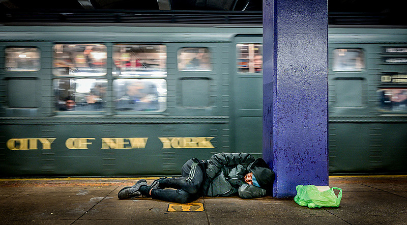 A man sleeps on a subway platform as the Nostalgia Train, a collection of subway cars dating back to the 1920's, departs a downtown ...