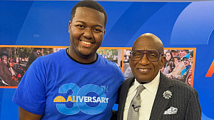 Josiah Acheampong stands with Al Roker