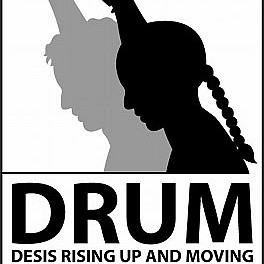 DRUM logo shadow of woman holding fist up