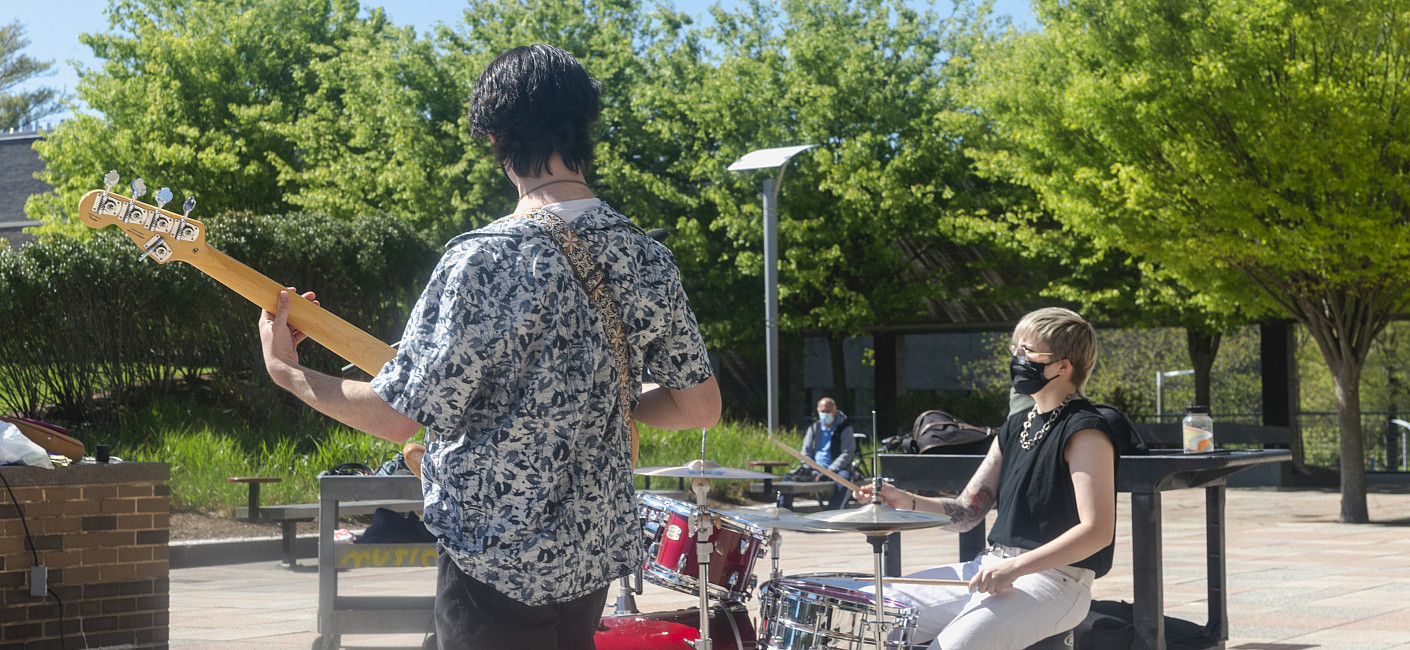 Students play music on the main plaza.