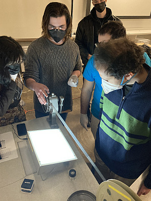 students inspecting 16mm film
