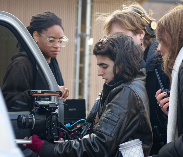 Zeena w crew (2) A student film crew crowded around a camera.