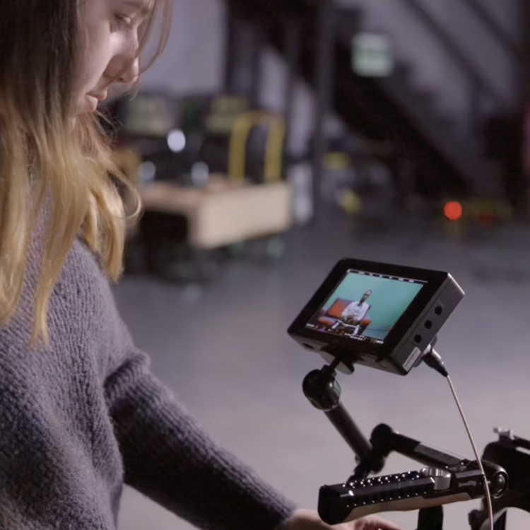 Student operating a camera