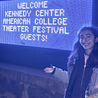 Playwright Sierra Blanco at event welcome sign