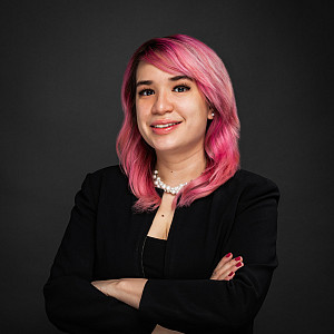 Melissa Rodriguez photo with pink hair and black sweater.