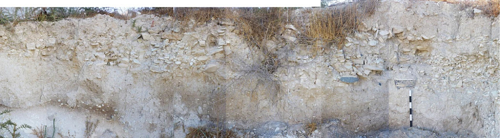 Arkhangelos Plot 336, architecture seen in bulldozer cut, dated by in-situ pottery fragments of Proto-White Slip and...