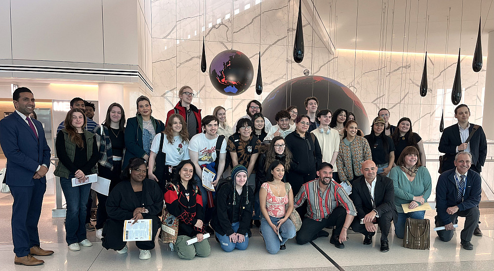 Students view the art on display in LaGuardia Airport Terminals B and C