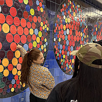 Students view the art on display in LaGuardia Airport Terminals B and C