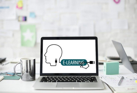 open laptop with e-learning logo displayed on the screen.
